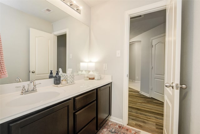 115 Meadow Ridge Way, Clute, TX 77531 - bathroom with vanity and wood finished floors