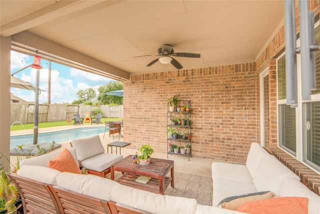 115 Meadow Ridge Way, Clute, TX 77531 - fenced backyard featuring outdoor lounge area, ceiling fan, and a patio area