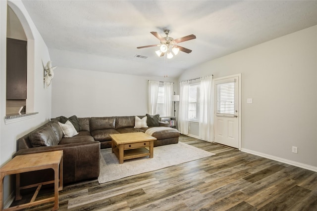 115 Meadow Ridge Way, Clute, TX 77531 - living room with wood finished floors, ceiling fan, lofted ceiling, and arched walkways