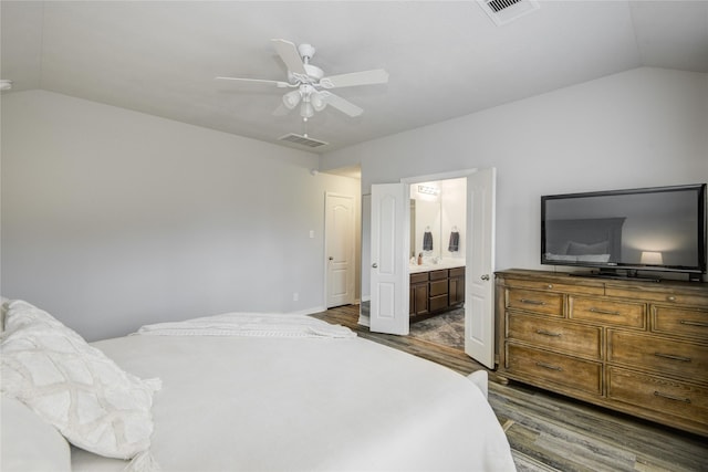115 Meadow Ridge Way, Clute, TX 77531 - bedroom featuring vaulted ceiling, dark wood-style flooring, ensuite bathroom, and a ceiling fan