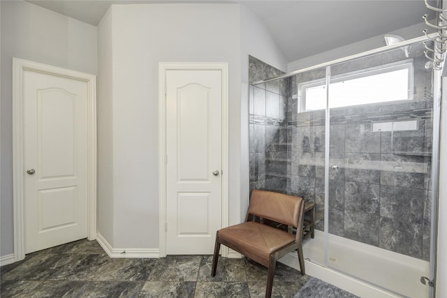 115 Meadow Ridge Way, Clute, TX 77531 - bathroom with a stall shower and vaulted ceiling