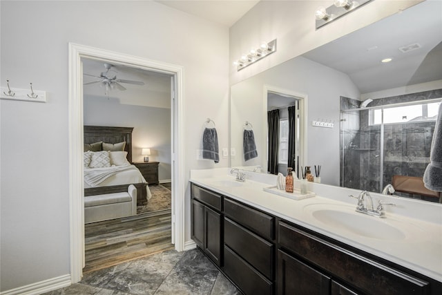 115 Meadow Ridge Way, Clute, TX 77531 - ensuite bathroom featuring double vanity, a ceiling fan, a stall shower, and lofted ceiling