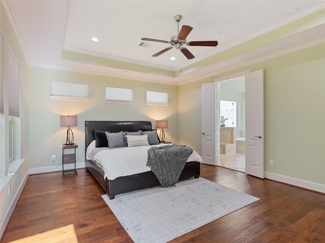 4635 Beech St, Bellaire, TX 77401 - bedroom featuring crown molding, hardwood / wood-style floors, a tray ceiling, ensuite bath, and ceiling fan
