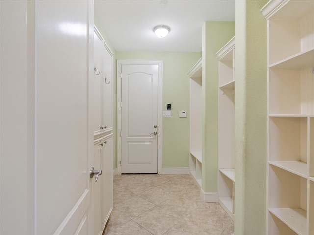 4635 Beech St, Bellaire, TX 77401 - mudroom featuring light tile patterned flooring