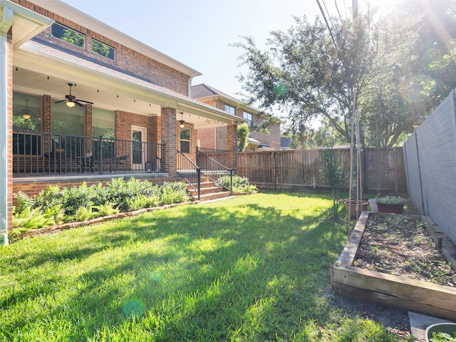 4635 Beech St, Bellaire, TX 77401 - fenced backyard with a garden and ceiling fan