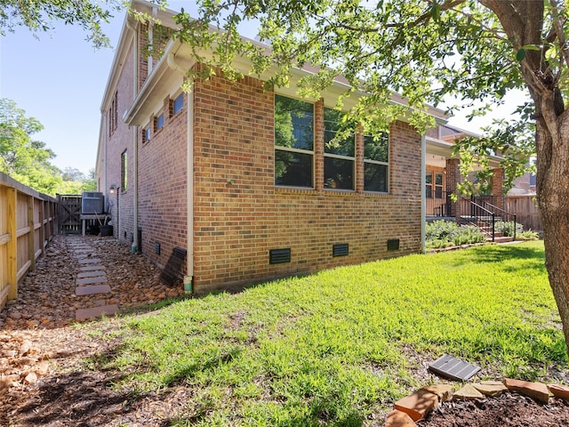 4635 Beech St, Bellaire, TX 77401 - view of side of property featuring crawl space and brick siding