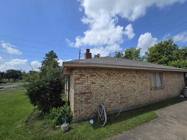 3902 Quiet Place Dr, Houston, TX 77082 - view of home's exterior with a yard, brick siding, and a chimney