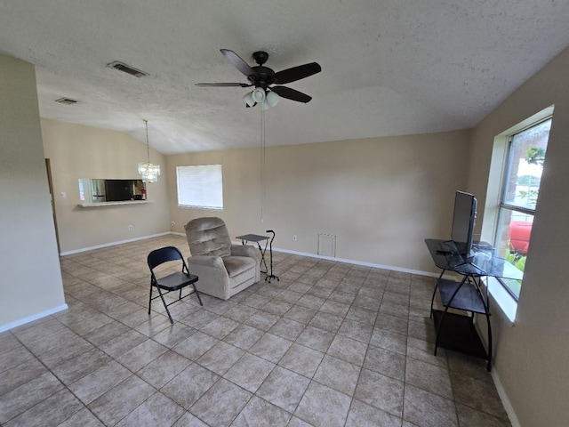 3902 Quiet Place Dr, Houston, TX 77082 - living area featuring lofted ceiling, a textured ceiling, a ceiling fan, a chandelier, and light tile patterned floors