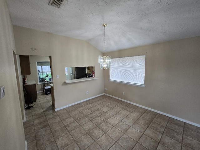 3902 Quiet Place Dr, Houston, TX 77082 - unfurnished dining area with a chandelier, lofted ceiling, a textured ceiling, and tile patterned floors