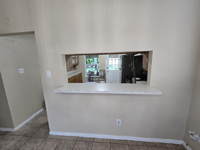 3902 Quiet Place Dr, Houston, TX 77082 - kitchen with freestanding refrigerator, tile patterned flooring, and a towering ceiling