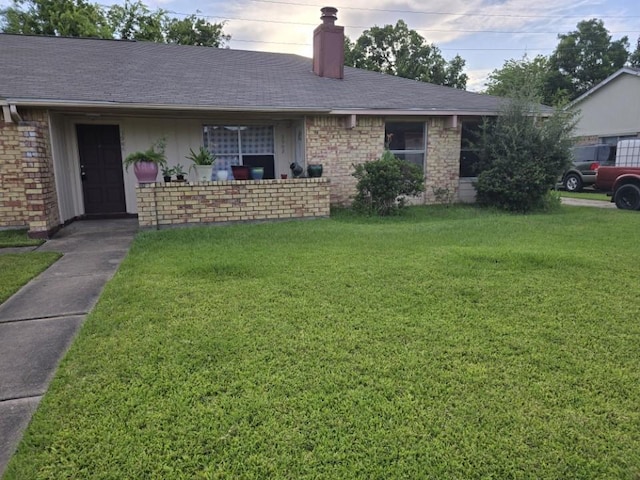 3902 Quiet Place Dr, Houston, TX 77082 - ranch-style home with a chimney, a front lawn, brick siding, and a shingled roof