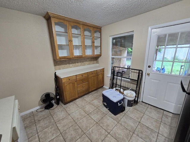 3902 Quiet Place Dr, Houston, TX 77082 - doorway to outside featuring a textured ceiling and light tile patterned flooring