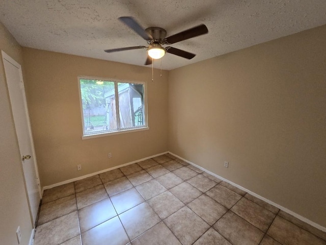 3902 Quiet Place Dr, Houston, TX 77082 - spare room featuring ceiling fan, a textured ceiling, and light tile patterned floors