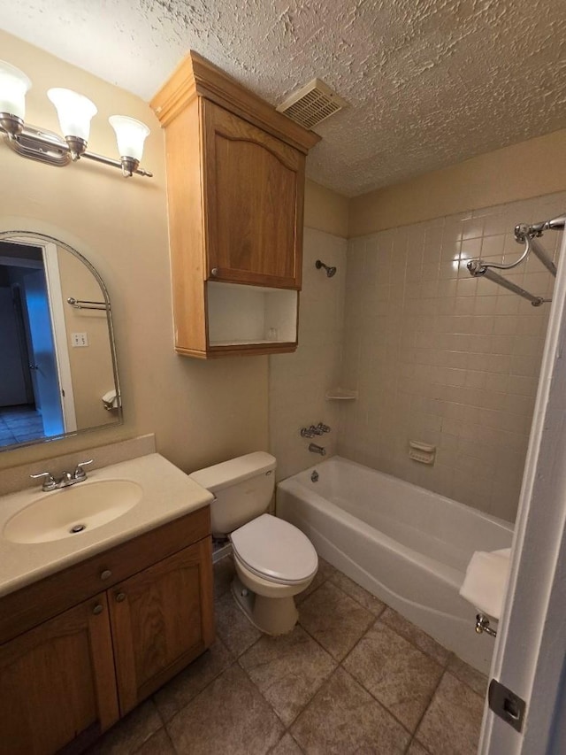 3902 Quiet Place Dr, Houston, TX 77082 - bathroom with vanity, shower / washtub combination, tile patterned flooring, and a textured ceiling