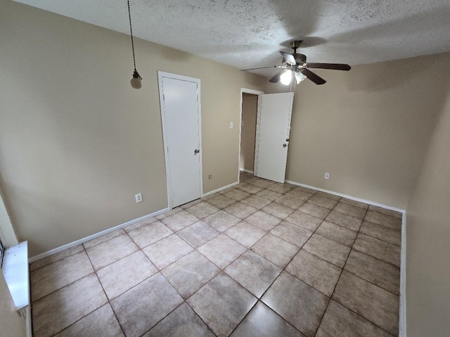 3902 Quiet Place Dr, Houston, TX 77082 - unfurnished room featuring a ceiling fan, a textured ceiling, and light tile patterned floors