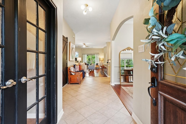 1095 Gladstone Dr, League City, TX 77573 - entrance foyer with arched walkways and light tile patterned floors
