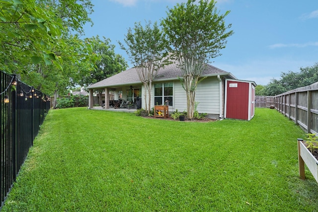 1095 Gladstone Dr, League City, TX 77573 - rear view of property with a fenced backyard, ceiling fan, a patio, roof with shingles, and a shed