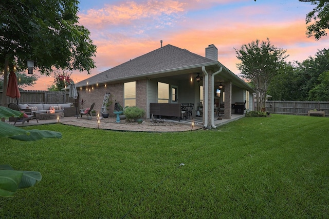 1095 Gladstone Dr, League City, TX 77573 - rear view of house featuring an outdoor living space, a chimney, a patio, and a fenced backyard