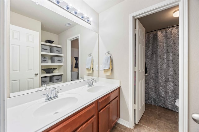 9859 Clanton Pines Dr, Humble, TX 77396 - bathroom with double vanity and tile patterned flooring