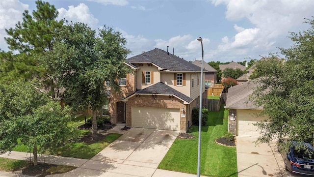 9859 Clanton Pines Dr, Humble, TX 77396 - traditional home featuring concrete driveway, brick siding, and roof with shingles