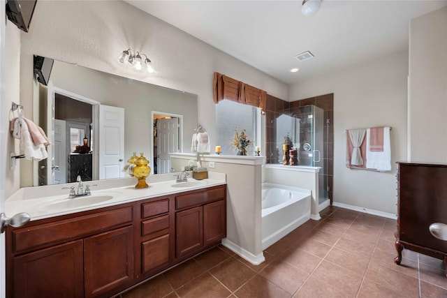 9859 Clanton Pines Dr, Humble, TX 77396 - bathroom featuring a stall shower, a bath, tile patterned floors, and double vanity
