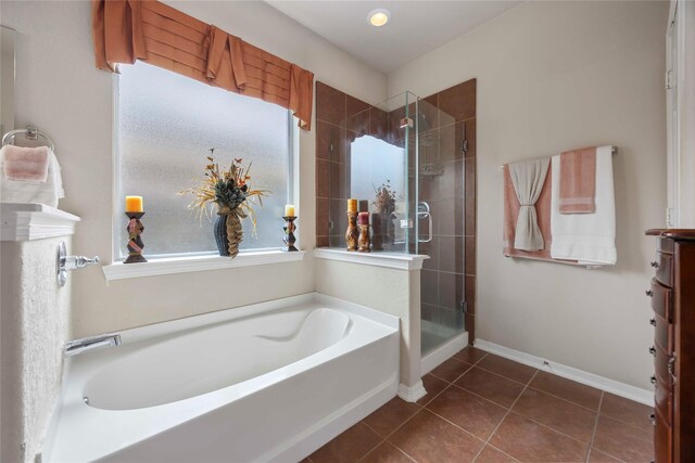 9859 Clanton Pines Dr, Humble, TX 77396 - bathroom featuring a bath, a stall shower, tile patterned flooring, and vanity