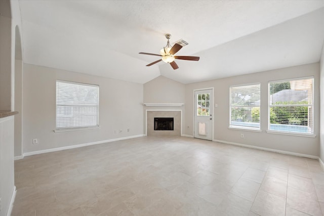 20703 Surrey Stone Ct, Katy, TX 77450 - unfurnished living room featuring ceiling fan, a fireplace, and vaulted ceiling