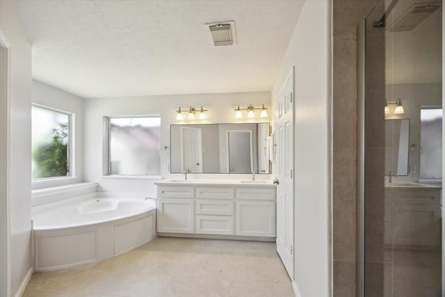 20703 Surrey Stone Ct, Katy, TX 77450 - full bathroom with double vanity, a shower stall, and a garden tub