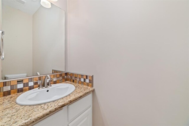 1102 Indian Autumn Trce, Houston, TX 77062 - half bath featuring tasteful backsplash and vanity