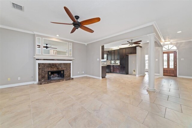 1102 Indian Autumn Trce, Houston, TX 77062 - unfurnished living room featuring decorative columns, ceiling fan, ornamental molding, recessed lighting, and a premium fireplace