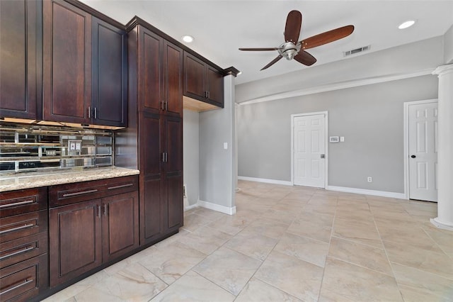 1102 Indian Autumn Trce, Houston, TX 77062 - kitchen featuring a ceiling fan, light stone counters, ornate columns, recessed lighting, and dark brown cabinets