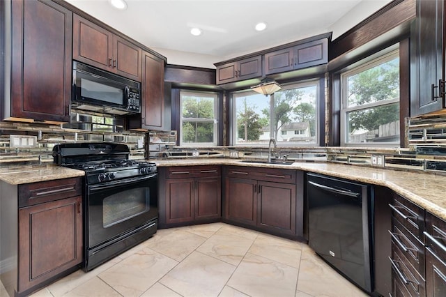 1102 Indian Autumn Trce, Houston, TX 77062 - kitchen featuring black appliances, decorative backsplash, light stone counters, recessed lighting, and dark brown cabinets