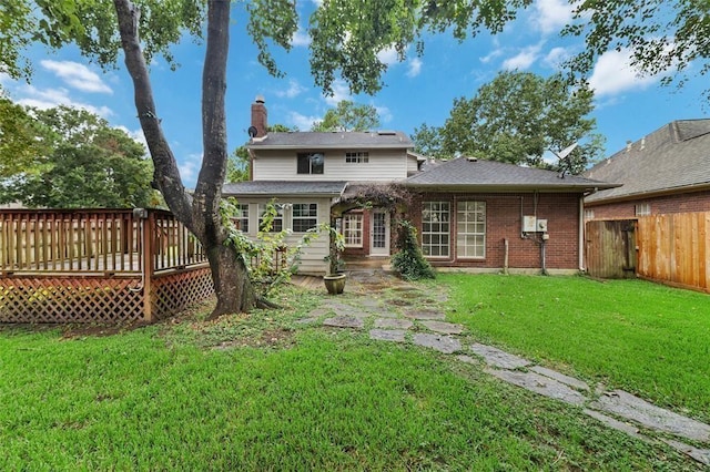 1102 Indian Autumn Trce, Houston, TX 77062 - back of property with a deck, a chimney, and brick siding