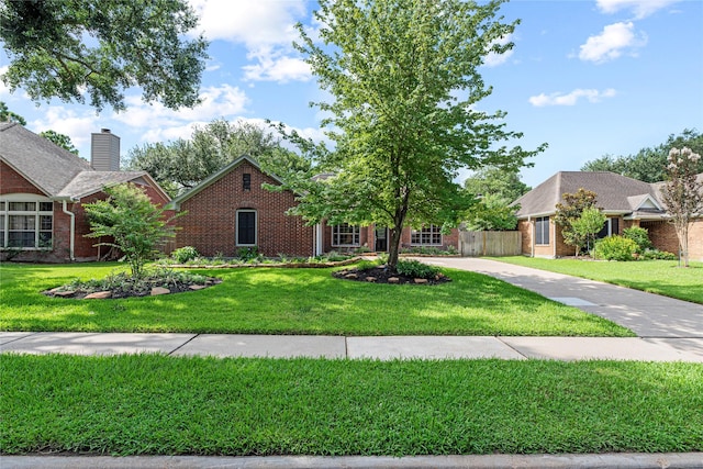16307 Rainbow Lake Rd, Houston, TX 77095 - view of front of home with brick siding and a chimney
