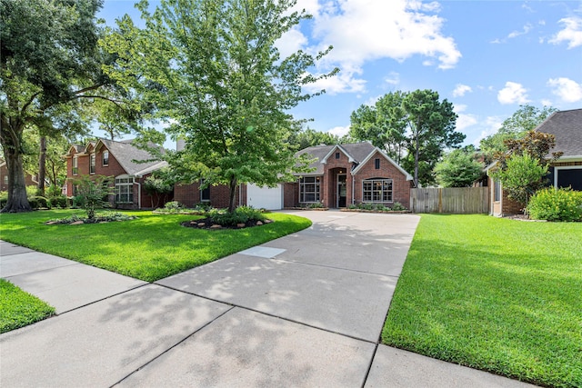 16307 Rainbow Lake Rd, Houston, TX 77095 - view of front of home with concrete driveway, a garage, and brick siding