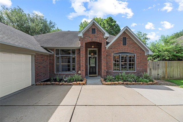 16307 Rainbow Lake Rd, Houston, TX 77095 - traditional-style home featuring brick siding, roof with shingles, concrete driveway, and an attached garage