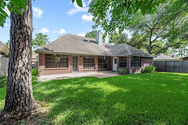 16307 Rainbow Lake Rd, Houston, TX 77095 - back of property with brick siding, a patio area, a chimney, and a fenced backyard