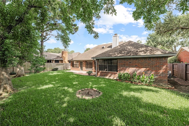 16307 Rainbow Lake Rd, Houston, TX 77095 - back of property with brick siding, roof with shingles, a fenced backyard, and a patio area