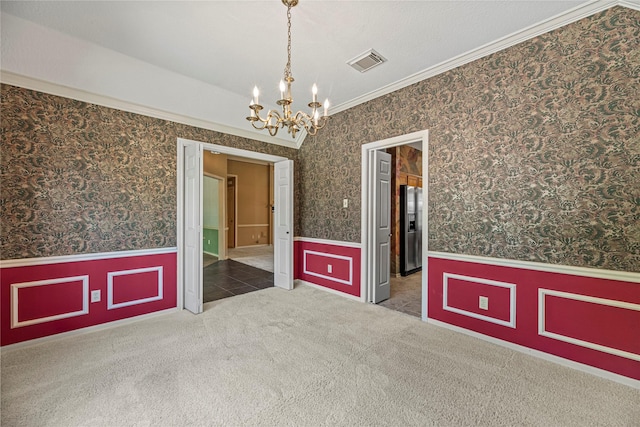 16307 Rainbow Lake Rd, Houston, TX 77095 - carpeted spare room featuring a chandelier, wainscoting, crown molding, and wallpapered walls