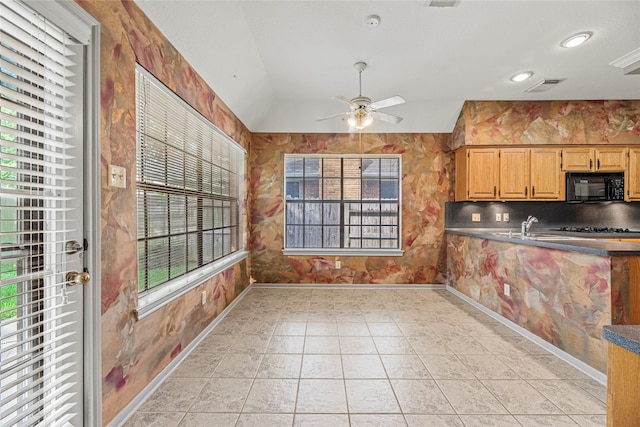 16307 Rainbow Lake Rd, Houston, TX 77095 - kitchen featuring black microwave, lofted ceiling, a ceiling fan, dark countertops, and stovetop