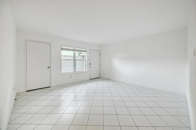 845 Augusta Dr Unit 17, Houston, TX 77057 - unfurnished room with light tile patterned flooring