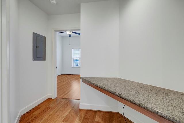 2203 Dorrington St Unit 406, Houston, TX 77030 - hallway with electric panel and light wood finished floors