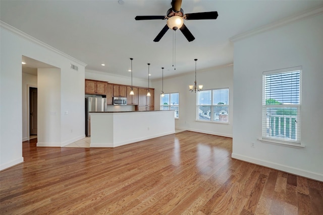 2203 Dorrington St Unit 406, Houston, TX 77030 - unfurnished living room with ornamental molding, a chandelier, light wood finished floors, ceiling fan, and recessed lighting