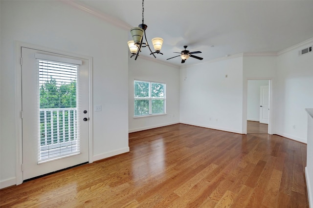 2203 Dorrington St Unit 406, Houston, TX 77030 - spare room with crown molding, light wood finished floors, a chandelier, and ceiling fan