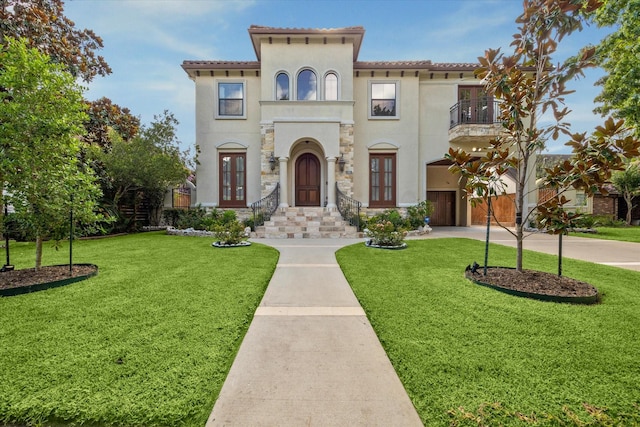 8518 Prichett Dr, Houston, TX 77096 - mediterranean / spanish home with french doors, a balcony, stucco siding, and a front yard