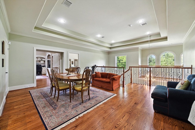 8518 Prichett Dr, Houston, TX 77096 - dining room with a raised ceiling, wood finished floors, crown molding, and recessed lighting