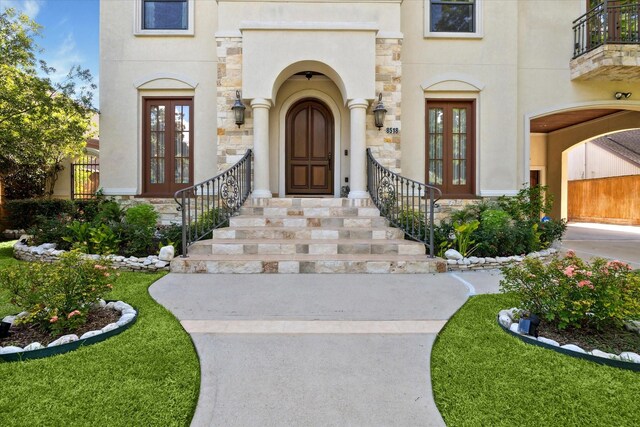 8518 Prichett Dr, Houston, TX 77096 - property entrance featuring french doors, stone siding, and stucco siding