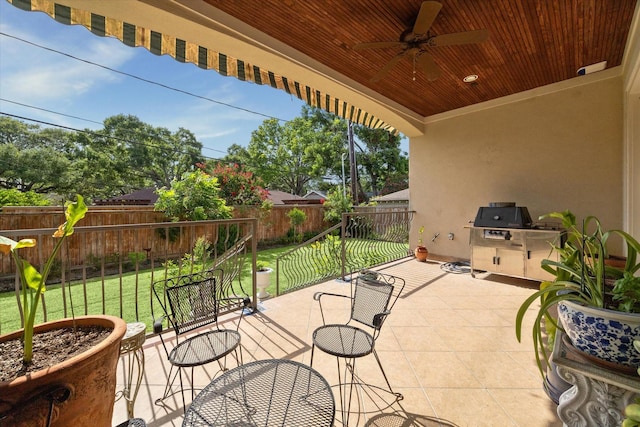 8518 Prichett Dr, Houston, TX 77096 - fenced backyard with ceiling fan, a patio, and an outdoor kitchen