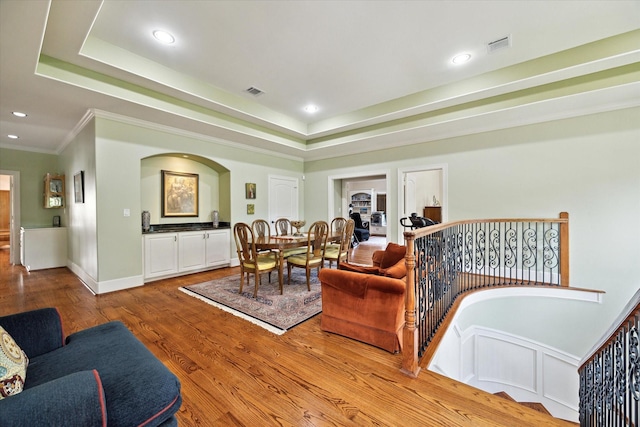 8518 Prichett Dr, Houston, TX 77096 - living room with wood finished floors, recessed lighting, crown molding, and a tray ceiling