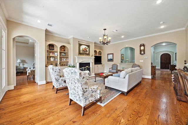 8518 Prichett Dr, Houston, TX 77096 - living area with arched walkways, a fireplace, recessed lighting, light wood-style floors, and ornamental molding